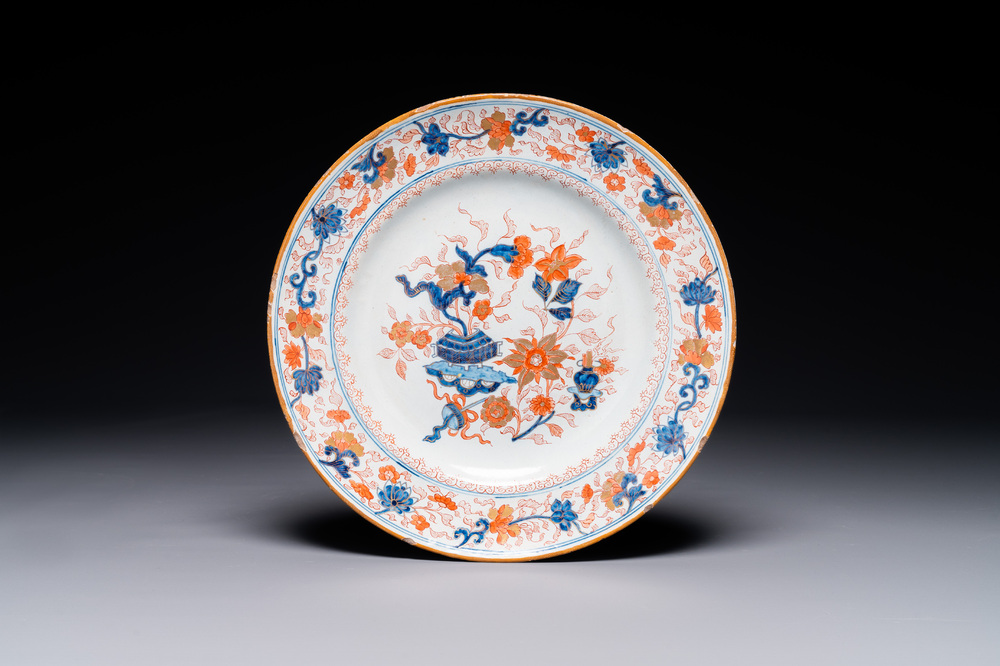 A Dutch Delft Imari-style dish with antiquities, 'AK' mark, 18th C.
