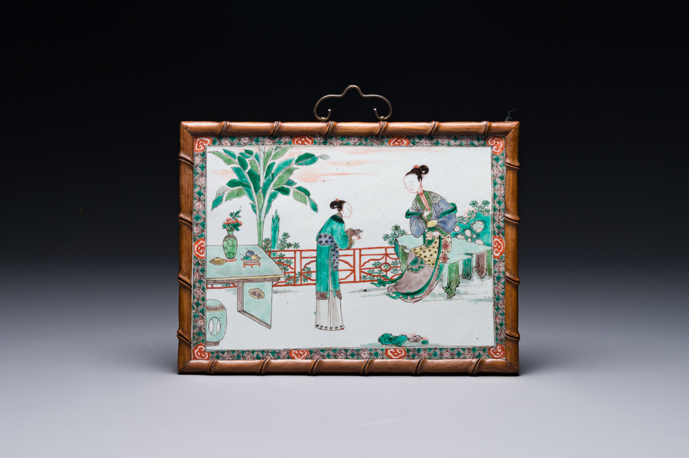A rectangular Chinese famille verte plaque in a wooden faux bamboo frame, Kangxi