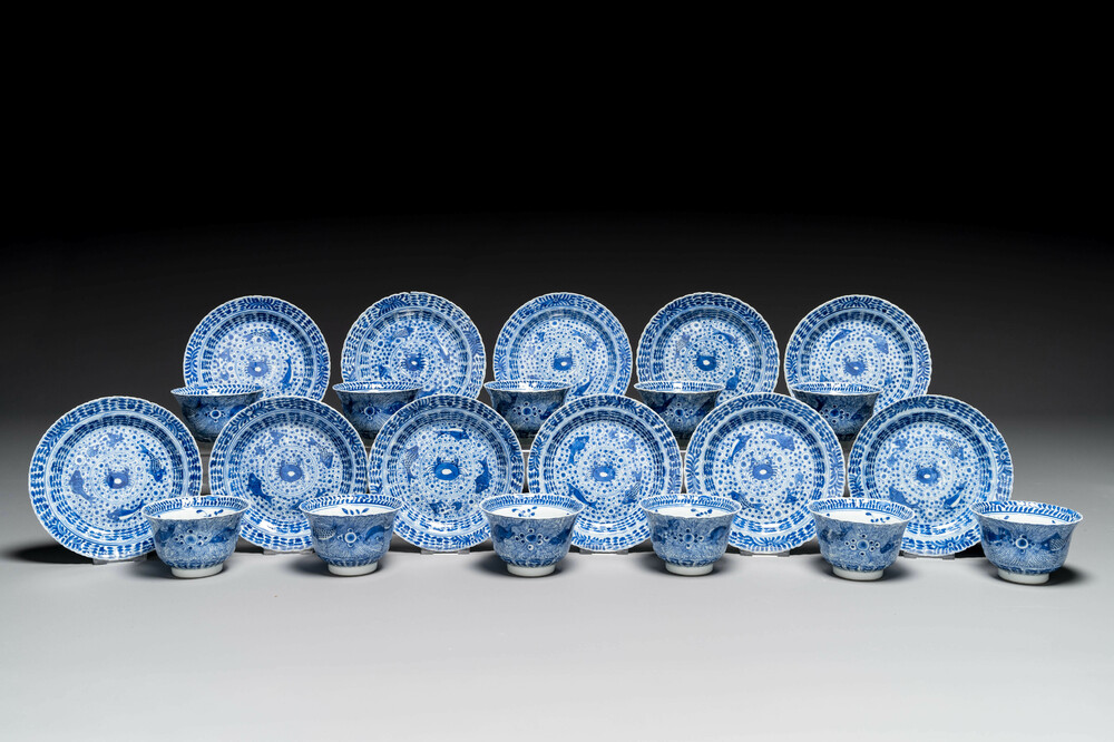 Eleven Chinese blue and white 'crab and fish' cups and saucers, Kangxi mark, Guangxu