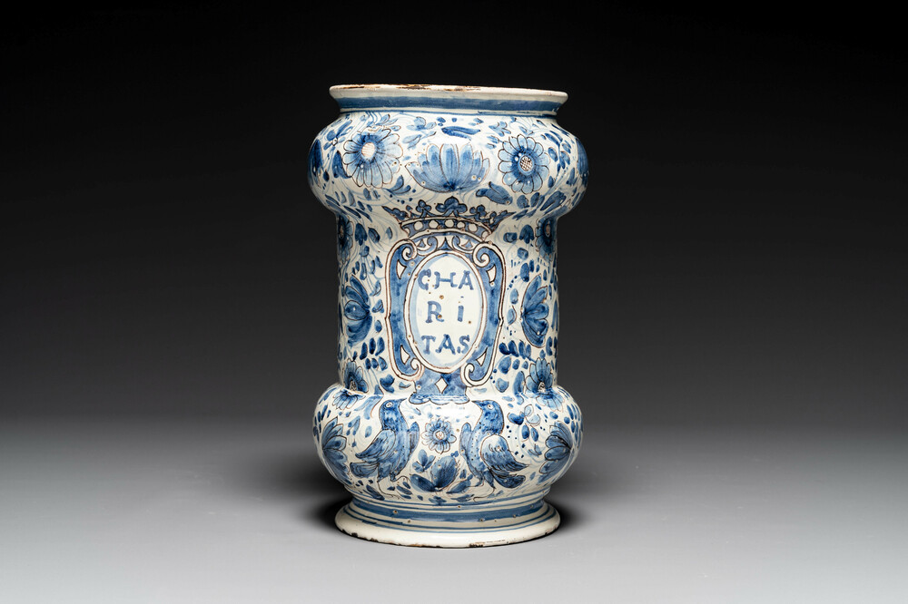 A large Italian blue, white and manganese albarello drug jar inscribed Charitas, probably Savona, dated 1767