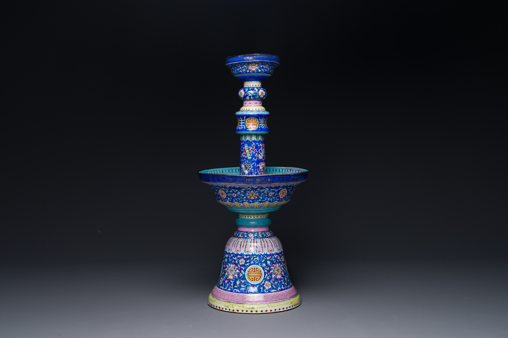 A large Chinese Canton enamel blue-ground 'shou' candlestick, Qianlong/Jiaqing