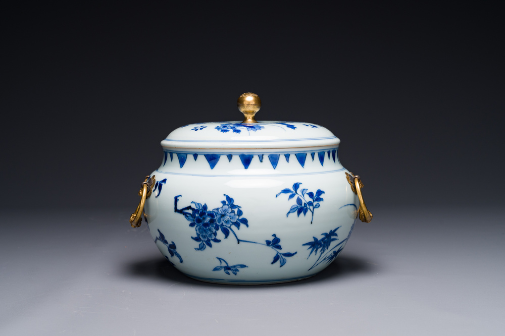 A Chinese blue and white covered bowl with floral design and gilt bronze mounts, Transitional period