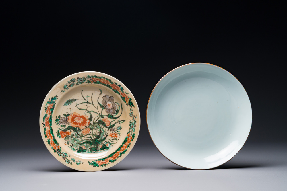 A Chinese famille verte caf&eacute;-au-lait ground plate and a monochrome white plate, Kangxi