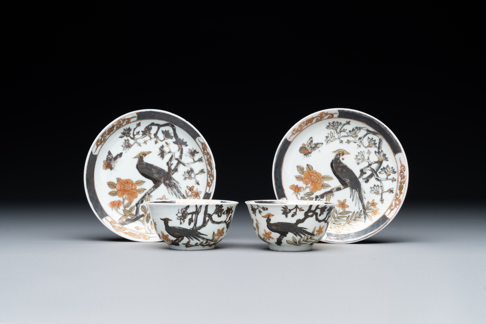 A pair of Chinese grisaille and gilt 'pheasant' cups and saucers, Yongzheng
