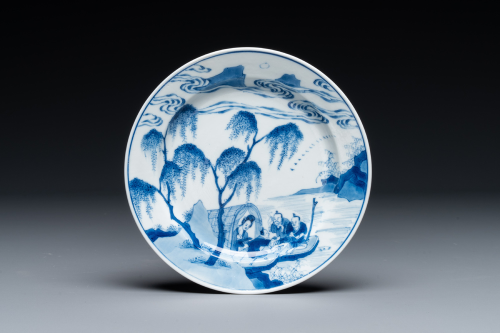 A Chinese blue and white plate with a breastfeeding woman and fishermen on boats, Chenghua mark, Kangxi