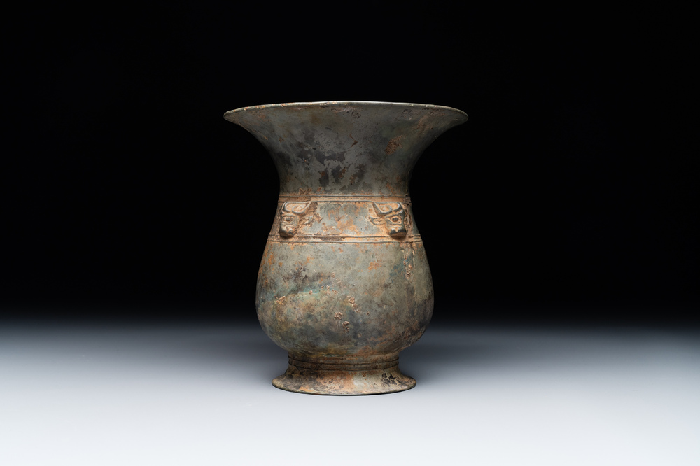 A Chinese archaic bronze ritual wine vessel with buffalo heads, 'zhi 觯', Western Zhou