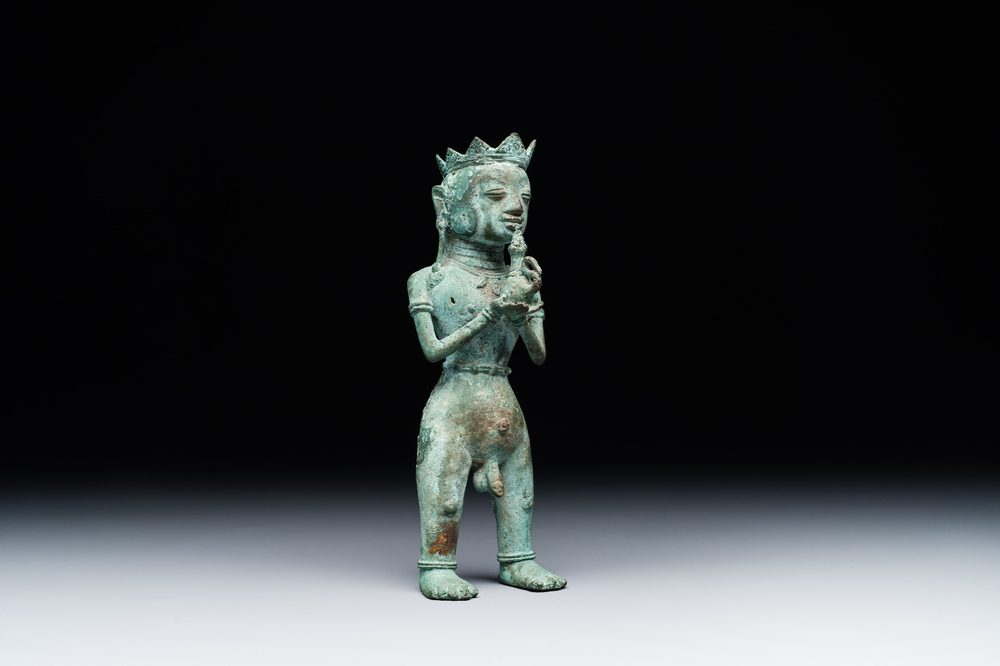 An fine Indonesian bronze sculpture of a naked man offering a sacrificial vase, Majapahit, East Java, 13/14th C.
