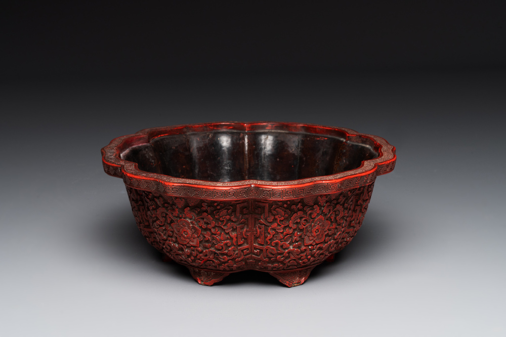 A Chinese red cinnabar lacquer jardiniere with floral design, Yongzheng/Qianlong