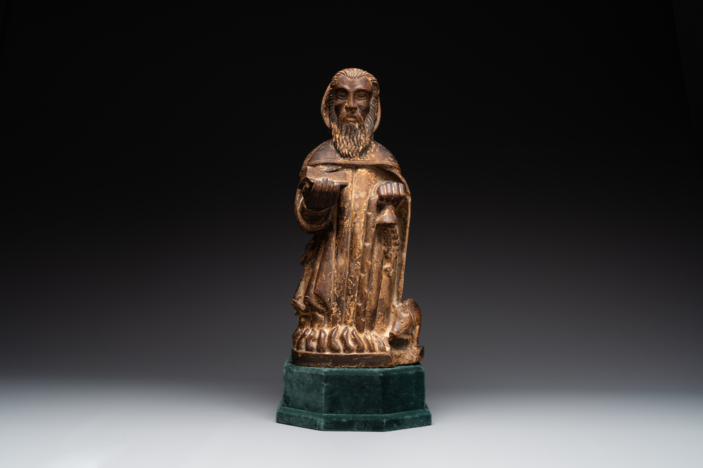 A large Burgundian stone sculpture of Saint Anthony the Great with attributes, France, 14th C.