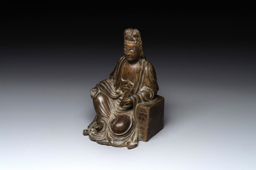 A rare Chinese parcel-gilt and lacquered pewter Guanyin, 17/18th C.