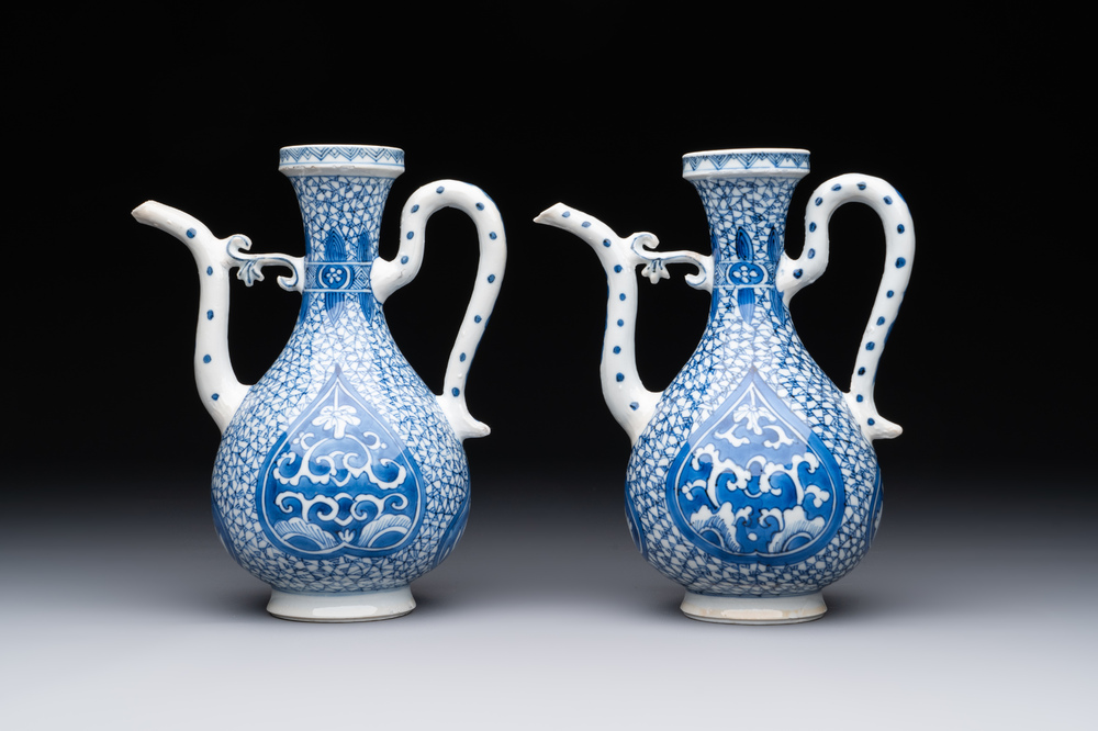 A pair of Chinese blue and white ewers with floral design, Kangxi