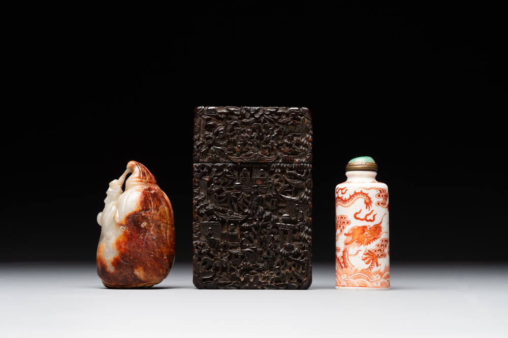 A Chinese jade carving, a tortoiseshell card holder and an iron-red snuff bottle, 19th C.