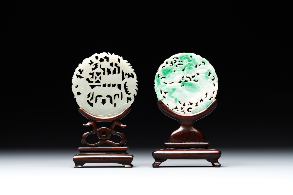 Two Chinese round jade plaques on carved wooden stands, 19th C.