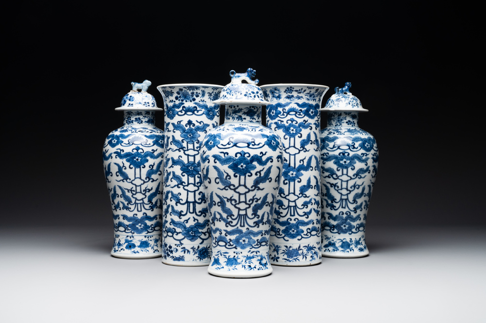 A Chinese blue and white garniture of five vases with lotus scrolls, 19th C.
