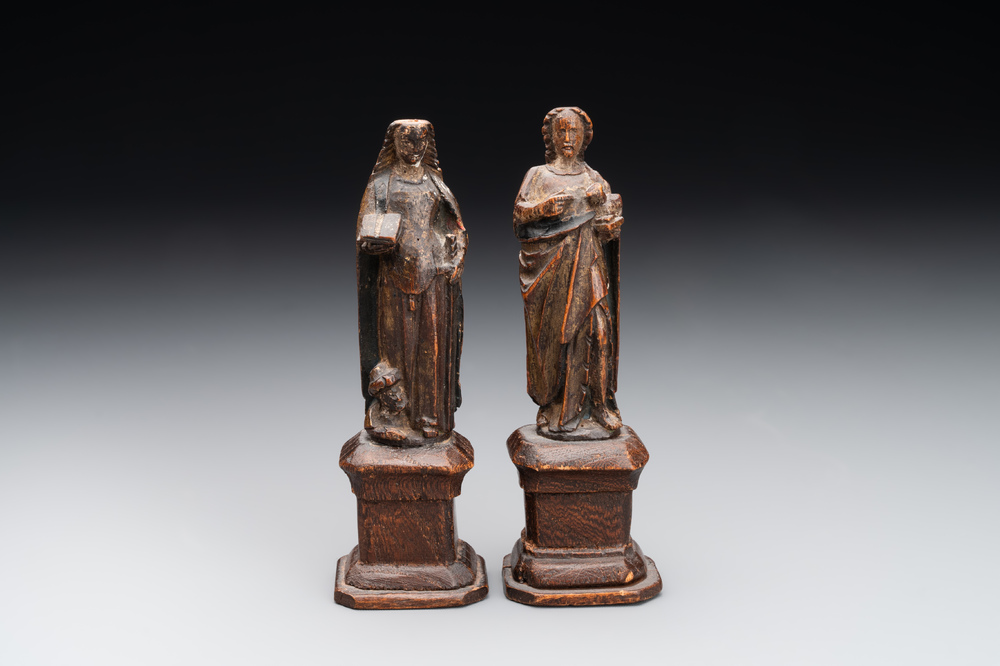 Two parcel-gilt and polychromed miniature oak sculptures of Saint John The Evangelist and Saint Catherine, 16th C.