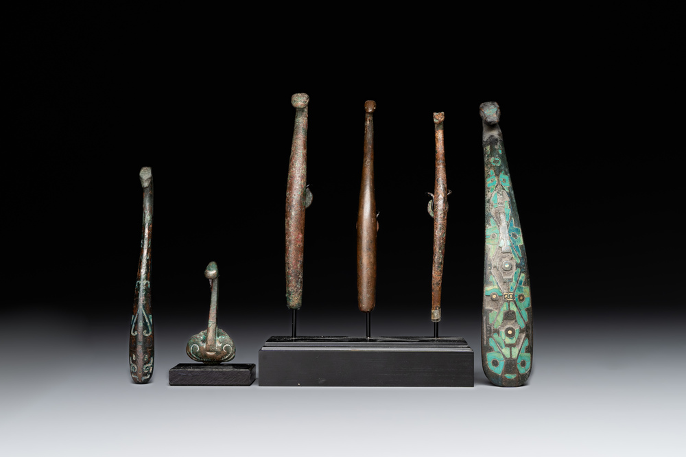 A varied collection of six Chinese bronze belt hooks, Warring States period and Western Han