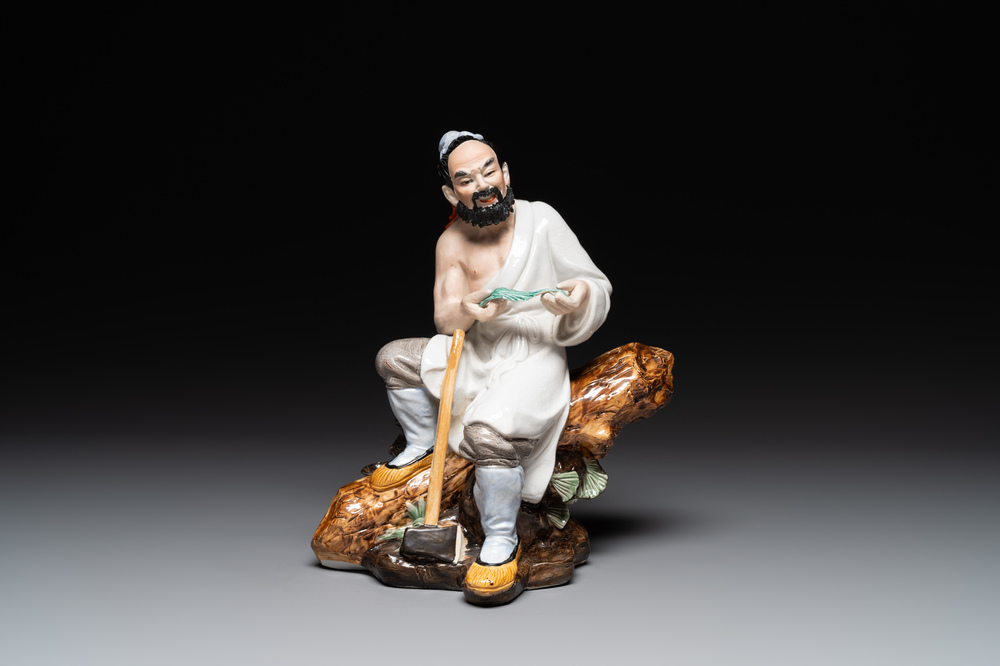 A Chinese polychrome sculpture of a lumberjack, Jingdezheng mark, 20th C.