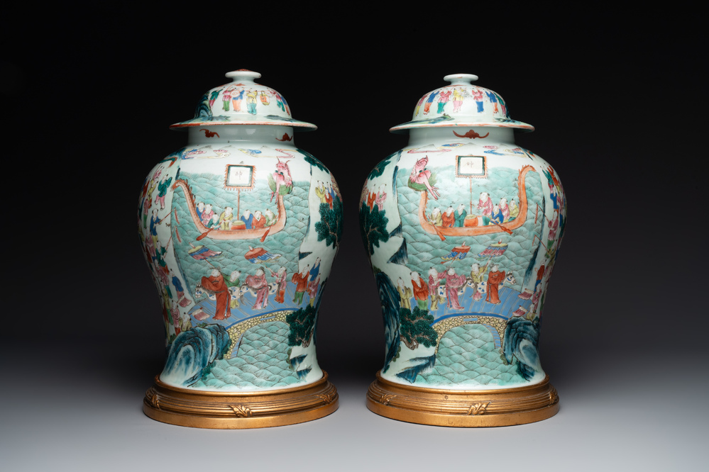 A pair of Chinese famille rose 'hundred boys' vases and covers on wooden stands, 19th C.
