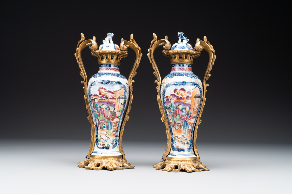 A pair of Chinese Canton famille rose 'mandarin subject' vases with gilt bronze mounts, Qianlong