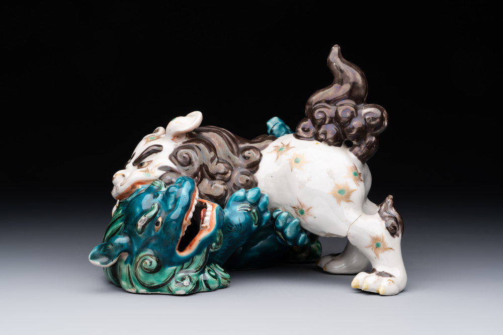 A Japanese polychrome-glazed group of playing Buddhist lions, 18/19th C.