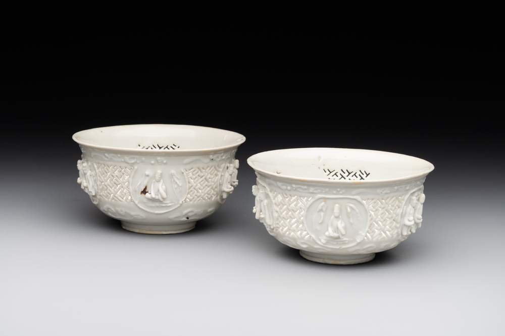 A pair of rare Chinese reticulated white-glazed biscuit 'Eight Immortals and Shoulao' bowls, Wanli