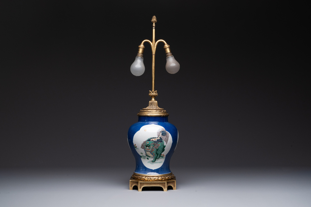A Chinese famille verte  powder-blue-ground 'mythical animal' vase with gilt bronze lamp mounts, 19th C.