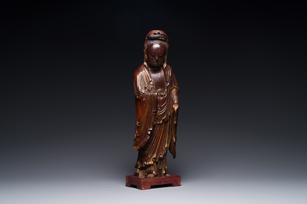 A Chinese partly gilt and lacquered wooden sculpture of Guanyin, Ming