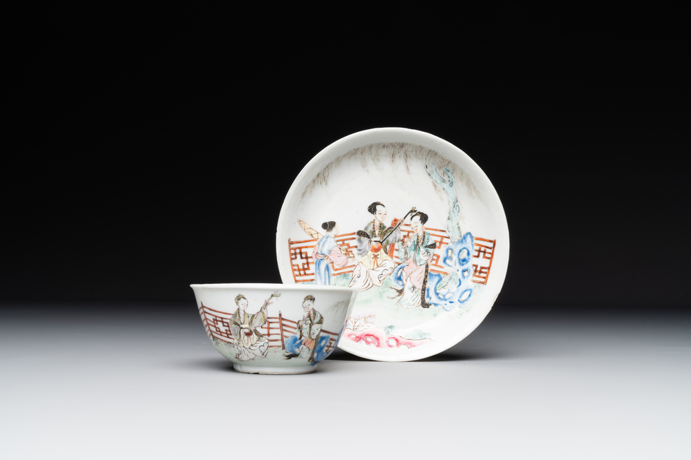 A Chinese famille rose cup and saucer with music making ladies, Yongzheng/Qianlong