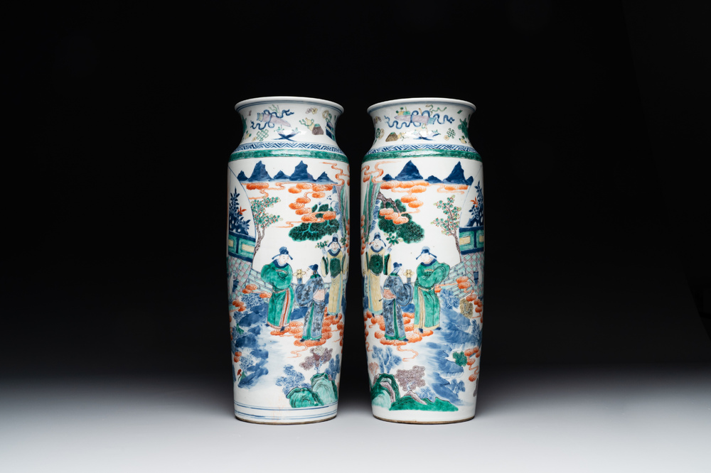 A pair of Chinese famille verte rouleau vases with narrative design, 19th C.