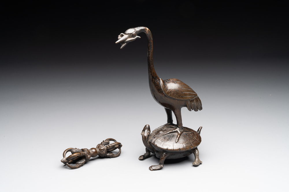 A Chinese bronze candle or incense holder in the shape of a crane standing on a turtle and a Tibetan vajra, Ming/Qing