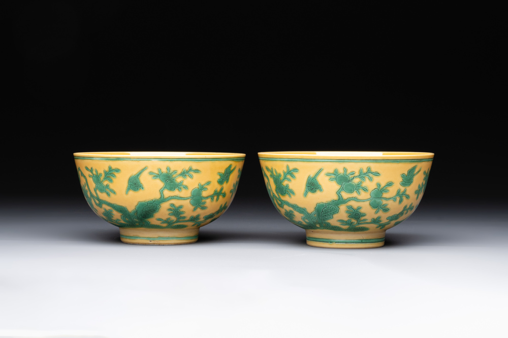 A pair of Chinese yellow-ground 'peach and bird' bowls, Qianlong mark and probably of the period