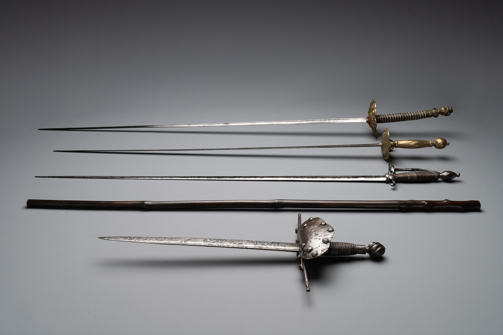 A varied collection of 4 European swords and a walking stick-blade, 17/19th C.
