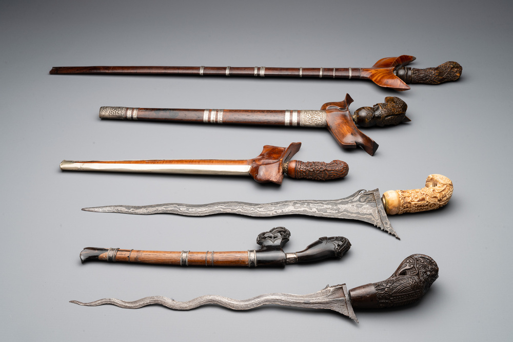 A collection of six krises with carved handles, four with scabbard, Indonesia, 19th C.