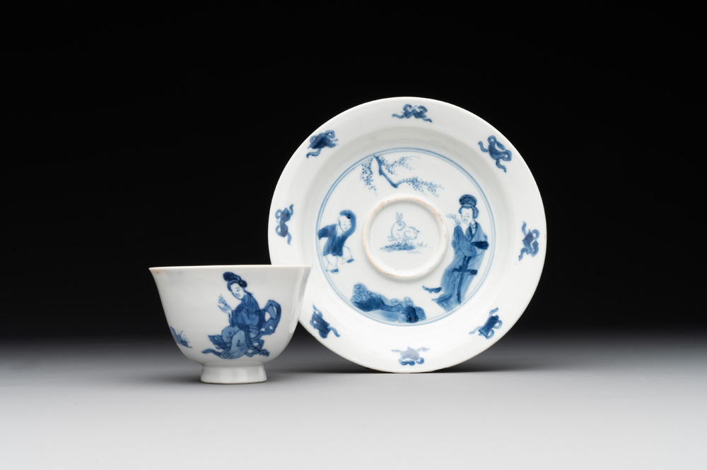 A Chinese blue and white 'Long Eliza and playing boy' cup and saucer, Qi Yu Mei Zhi 奇玉美製 and Bi Yu Tang Zhi 璧玉堂製, Kangxi