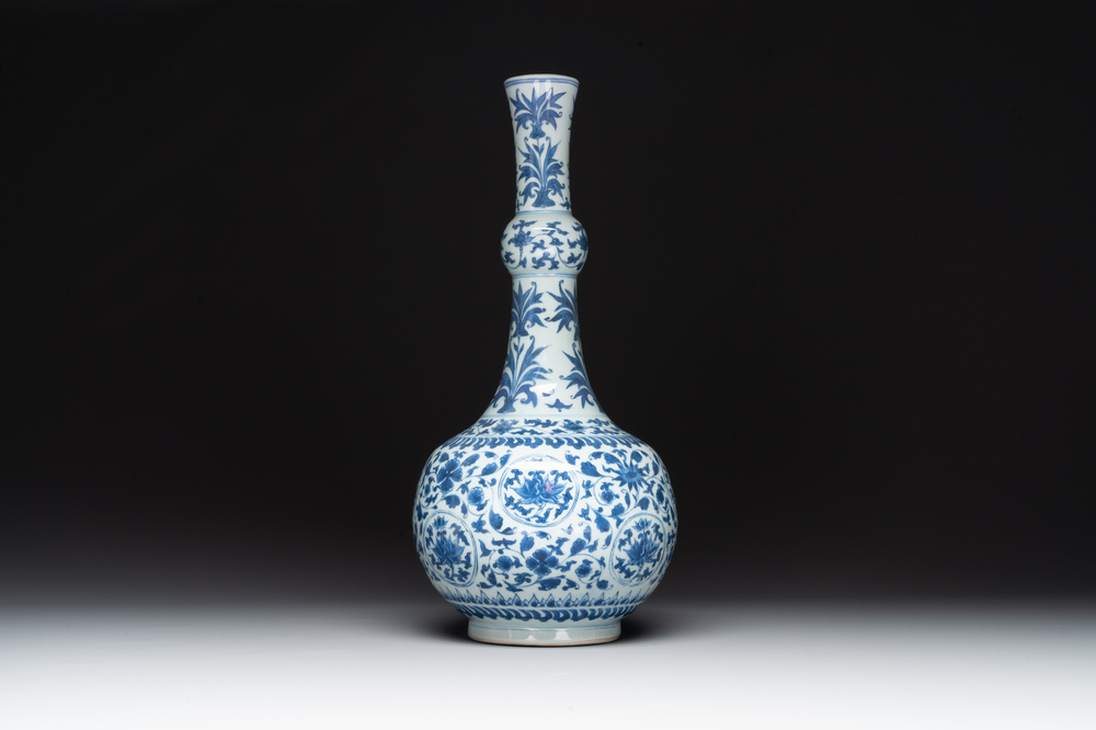 A Chinese blue and white 'lotus scroll' bottle vase, Transitional period