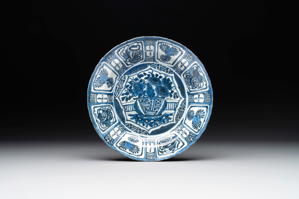 A Chinese blue and white kraak porcelain dish with flowers in a jardiniere, Wanli