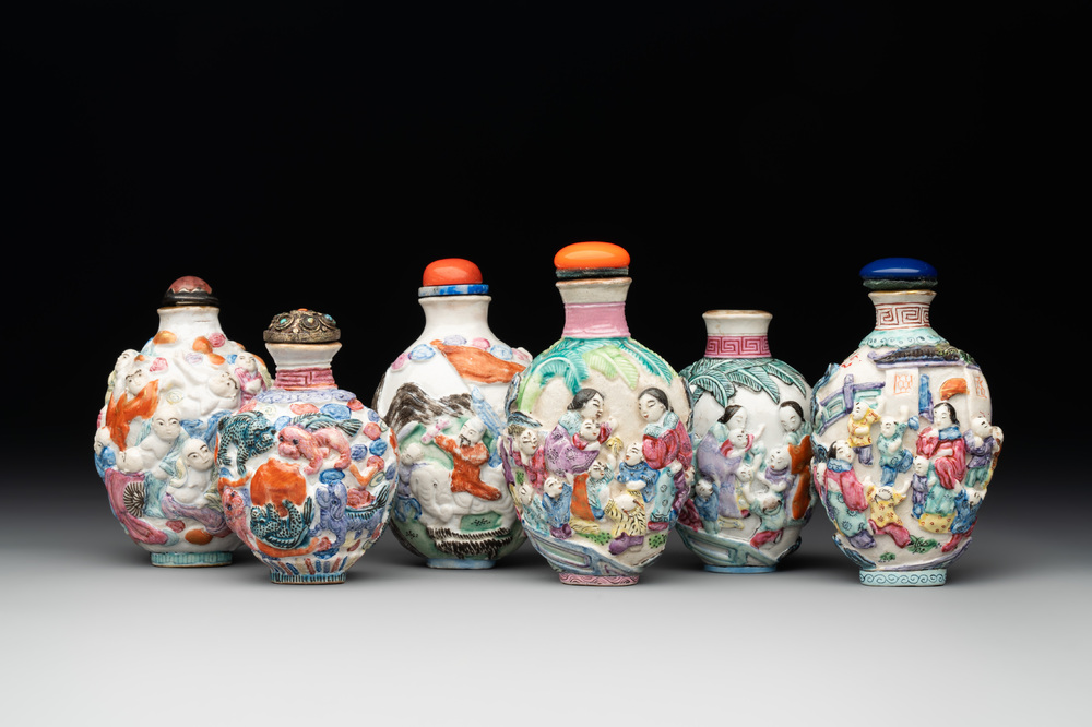 Six Chinese moulded famille rose snuff bottles, Qianlong mark, 19th C.