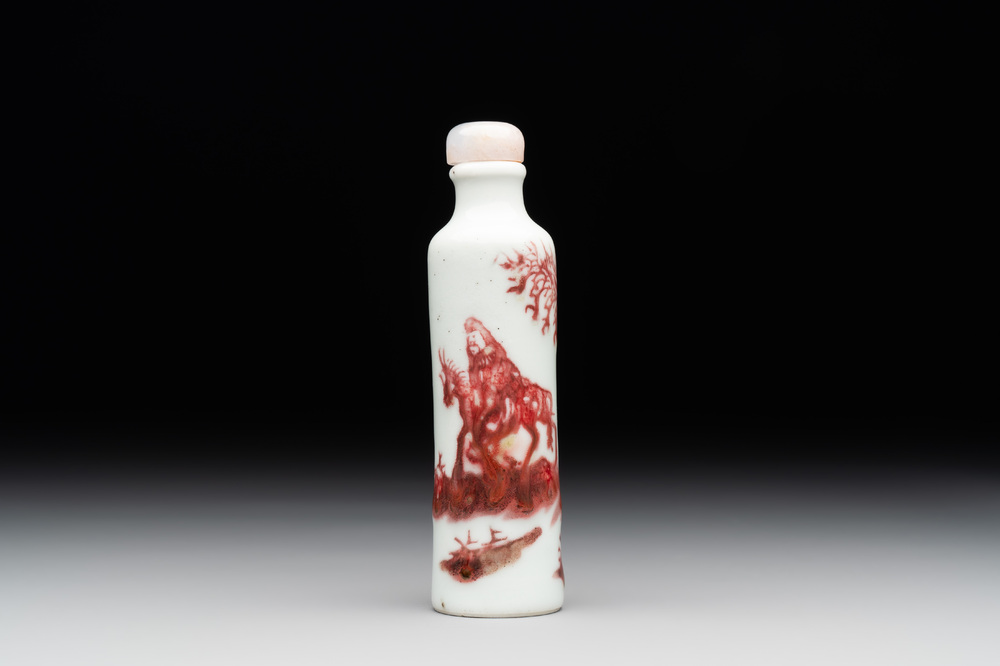 A Chinese copper-red snuff bottle with travellers in a landscape, Qianlong mark, 19th C.