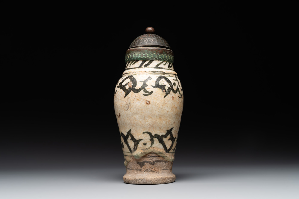 An early Islamic pottery albarello with engraved copper mount and cover, probably Nishapur, Iran, 10/11th C.
