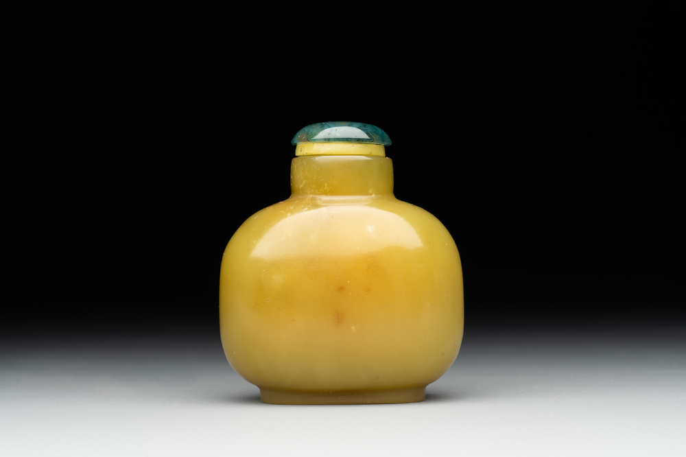 A Chinese yellow jade snuff bottle with moss agate cover and bone stopper, 19th C.