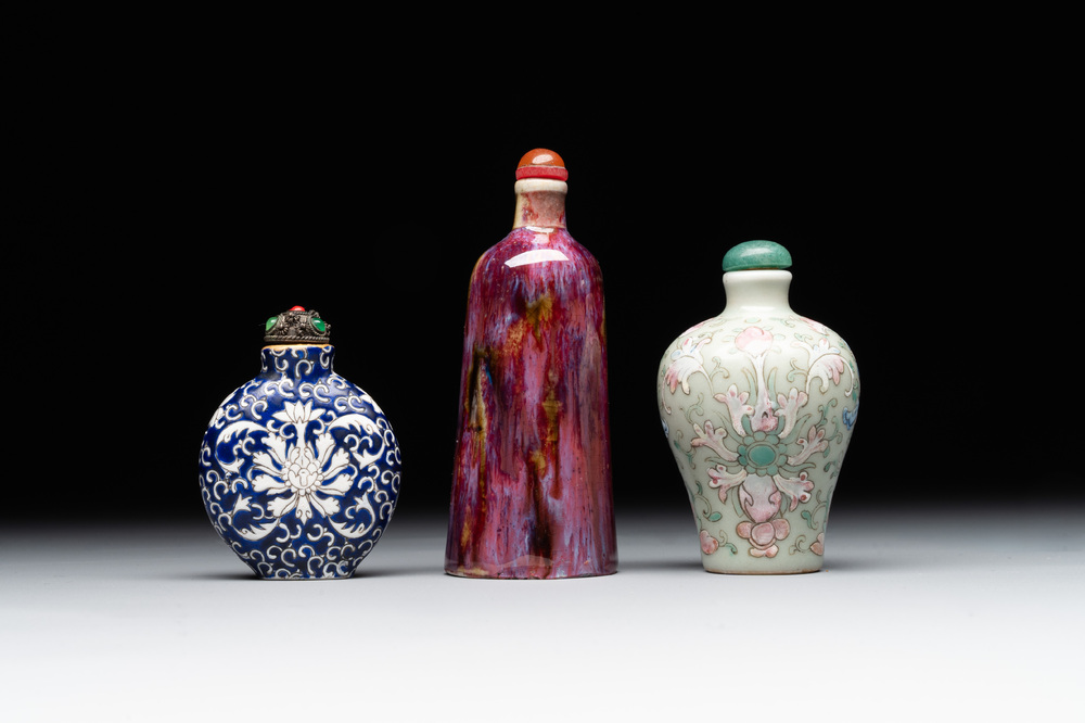 Two Chinese famille rose 'lotus scroll' snuff bottles and a flamb&eacute;-glazed snuff bottle, 19th C.