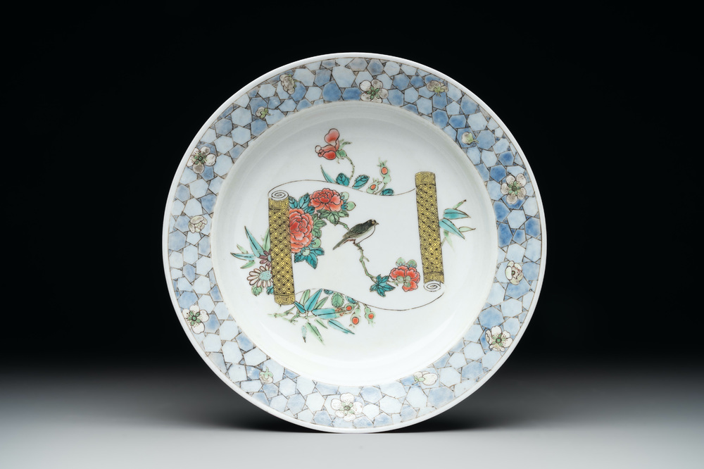 A fine Chinese famille rose 'ruby back' plate with a bird on a blossoming branch, Yongzheng