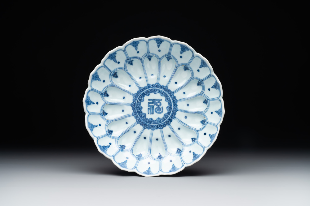 A rare Chinese lotus-shaped blue and white 'fu' dish, Kangxi mark and of the period