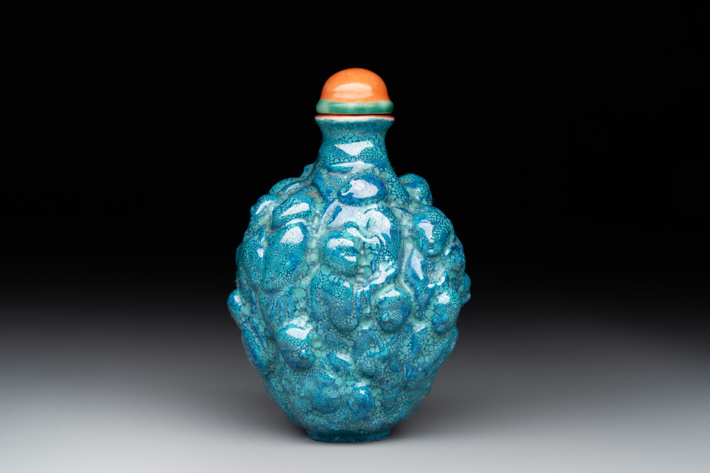 A rare Chinese robin's-egg-glazed moulded '18 Luohan' snuff bottle, 19th C.