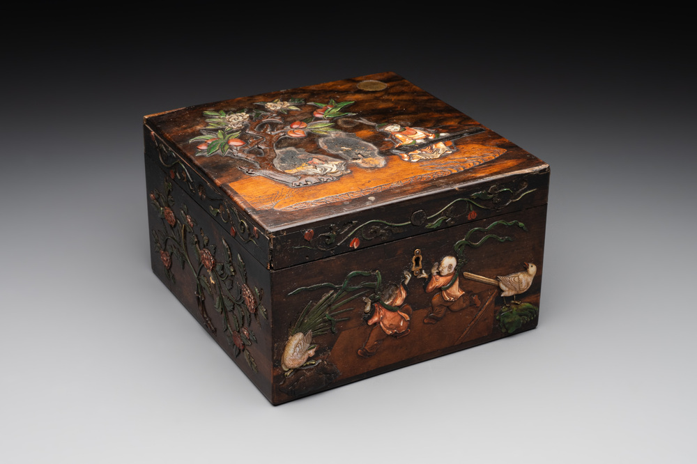 A square Chinese embellished and lacquered wooden box depicting a musician and two boys, Qing