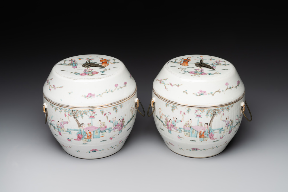 A pair of Chinese famille rose jars and covers with figures in a garden, Tongzhi mark and of the period