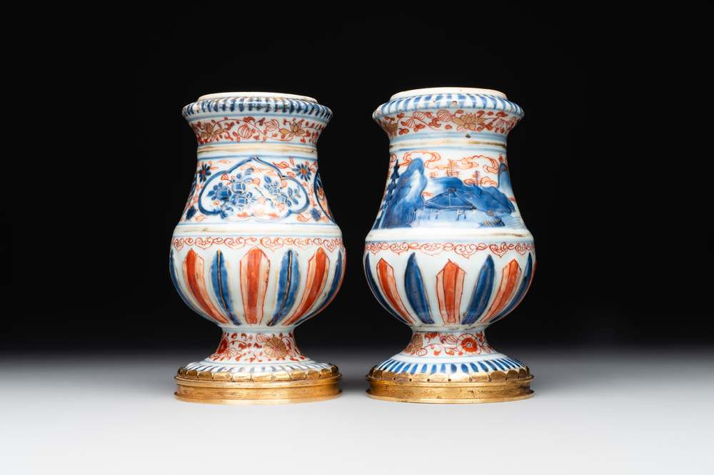A pair of Chinese Imari-style casters or vases with gilt bronze mounts, Kangxi