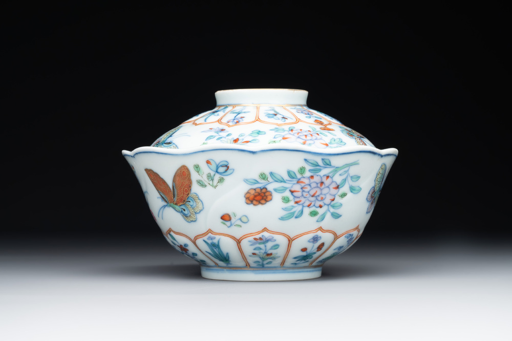 An exceptional Chinese gilt-decorated doucai and famille rose covered bowl with butterflies and floral design, Jiaqing mark and of the period