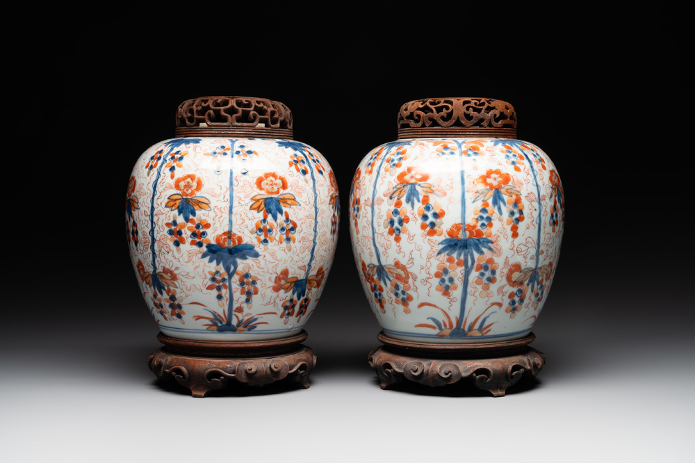 A pair of Chinese Imari-style 'grapevine' jars with wooden covers and stands, Kangxi