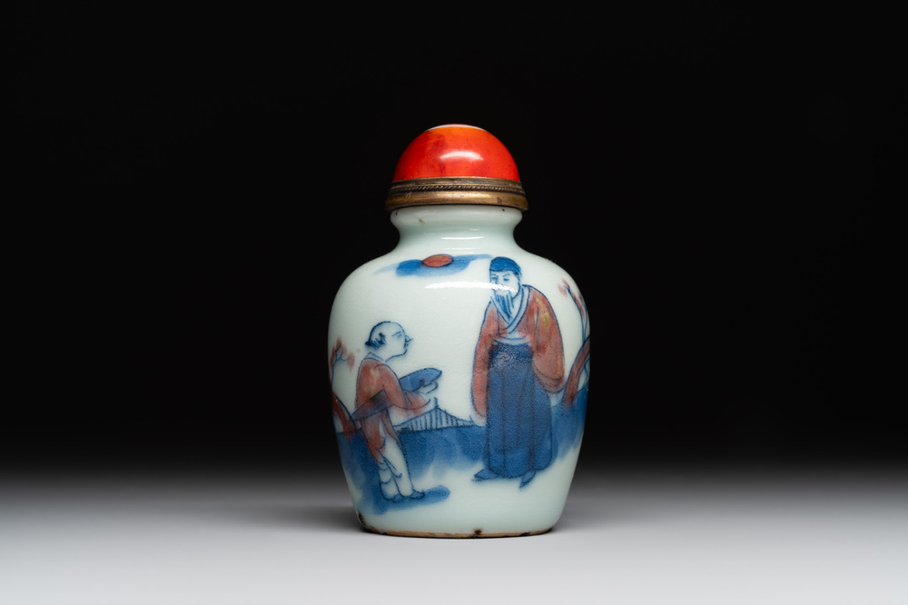 A Chinese blue, white and copper-red snuff bottle, 19th C.